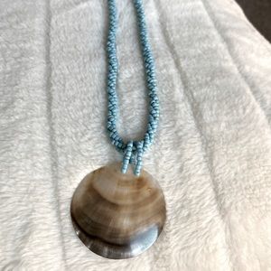 Turquoise bead necklace with mother of Pearl charm